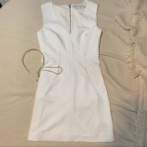 White Diane Von Furstenberg DVF formal dress with v-neck and pockets